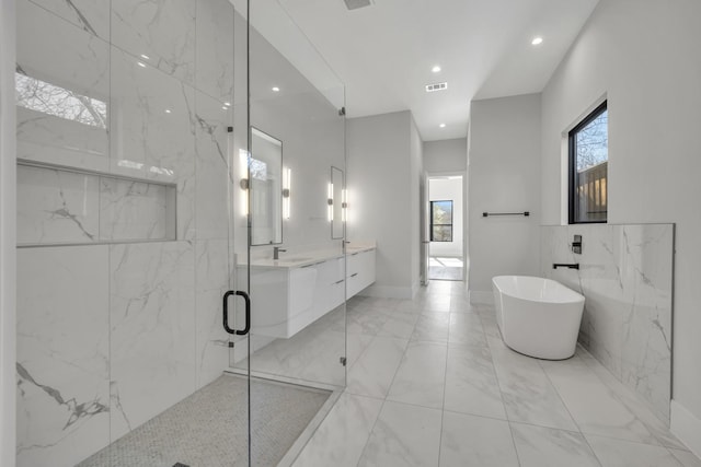 bathroom featuring vanity and plus walk in shower