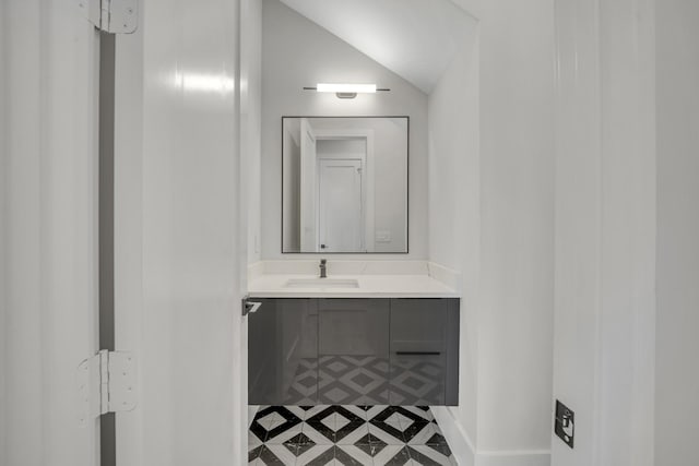 bathroom featuring vanity and vaulted ceiling