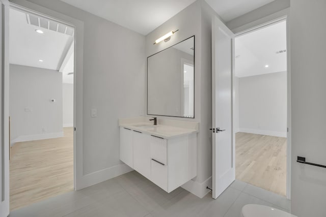 bathroom with tile patterned flooring and vanity