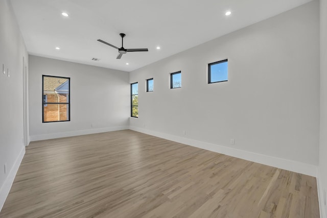 unfurnished room featuring light hardwood / wood-style floors and ceiling fan