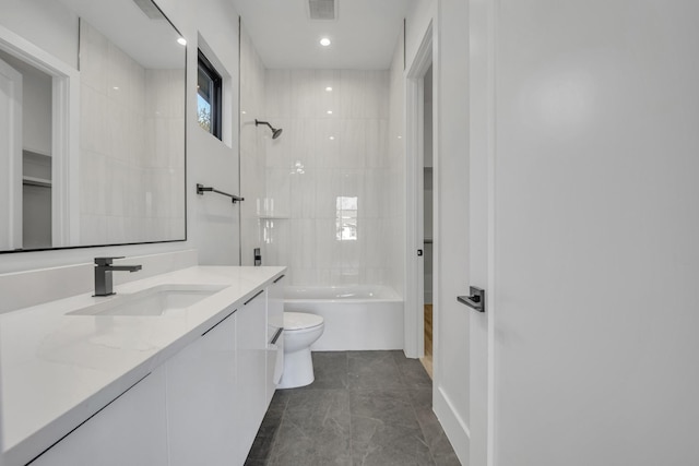 full bathroom with vanity, toilet, and tiled shower / bath combo