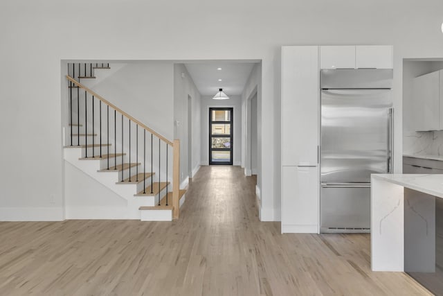 foyer with light wood-type flooring