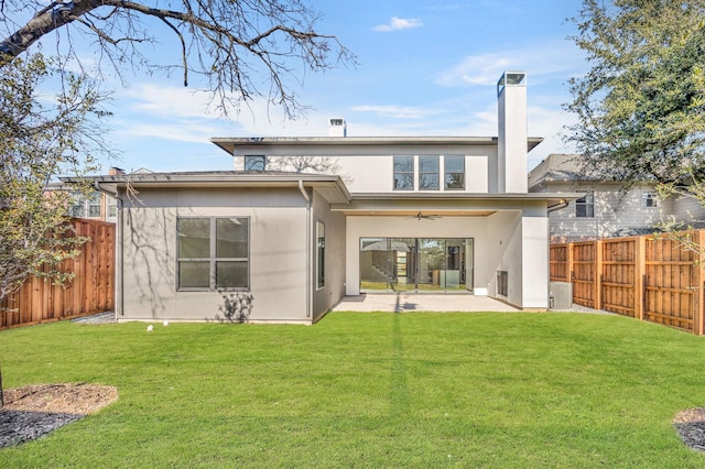 back of property featuring a lawn, ceiling fan, and a patio