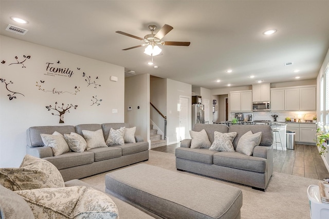 living room featuring ceiling fan