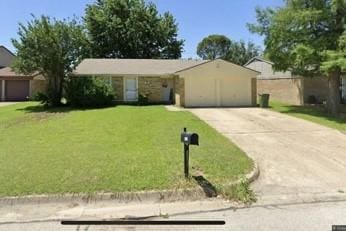 ranch-style home featuring a front yard and a garage