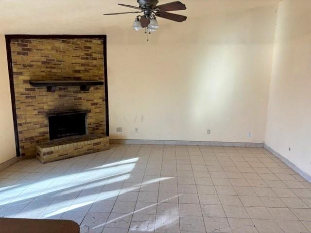 unfurnished living room featuring vaulted ceiling, a fireplace, ceiling fan, and light tile patterned floors