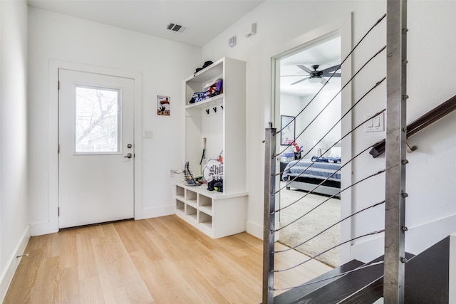 mudroom with ceiling fan and light hardwood / wood-style flooring