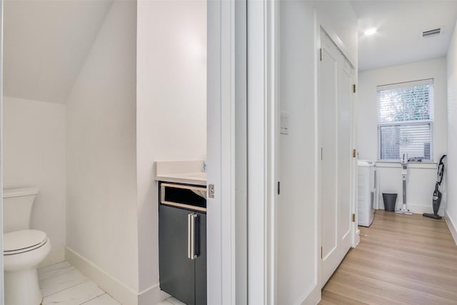 corridor featuring light hardwood / wood-style floors