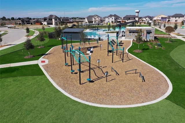 view of property's community featuring a playground and a yard