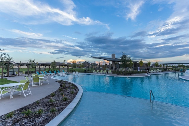 view of pool featuring a pergola and a patio