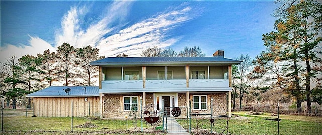 view of front facade featuring a front yard