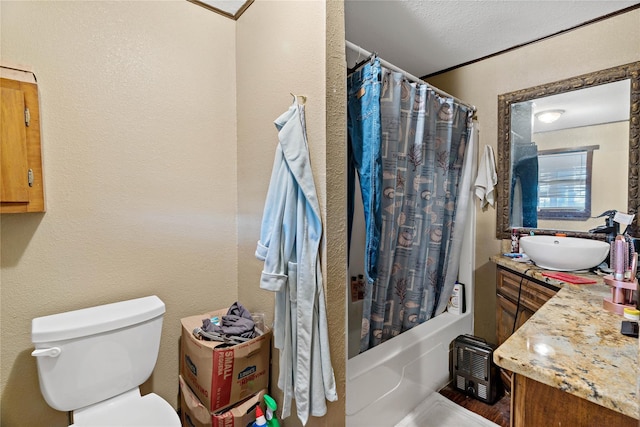 full bathroom with shower / tub combo, a textured ceiling, vanity, crown molding, and toilet