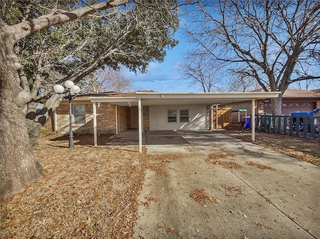 back of house with a carport