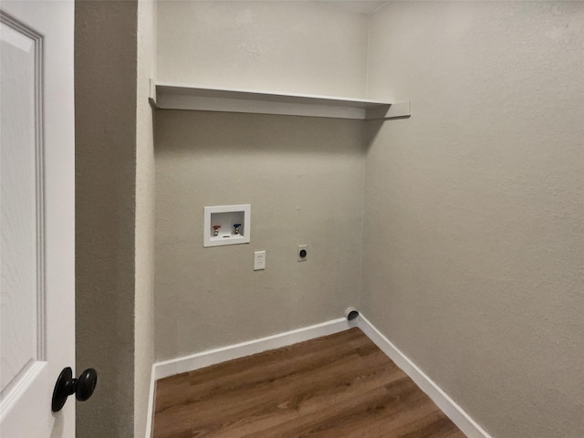 clothes washing area with wood-type flooring, washer hookup, and hookup for an electric dryer