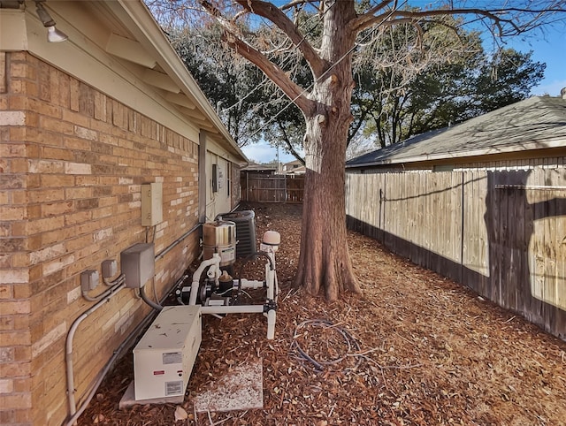 view of yard with central AC unit