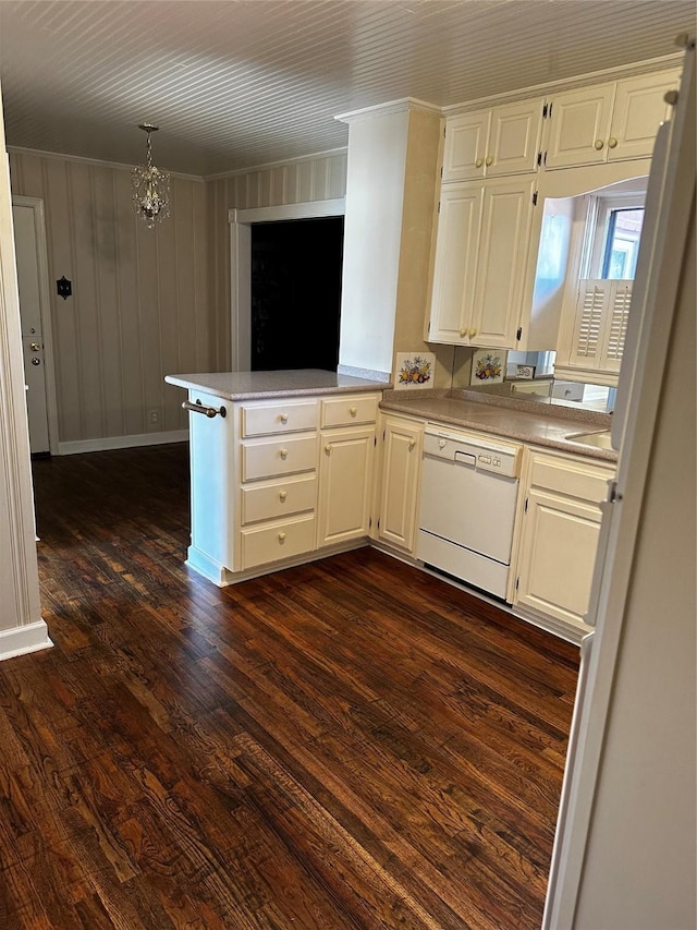 kitchen with dark wood finished floors, a peninsula, white cabinets, light countertops, and dishwasher