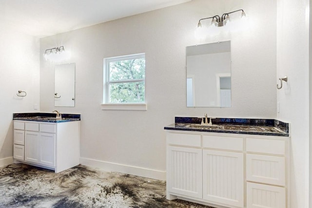 bathroom with vanity and concrete floors