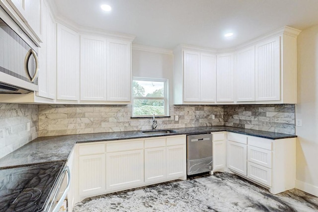 kitchen featuring white cabinetry, sink, ornamental molding, and appliances with stainless steel finishes