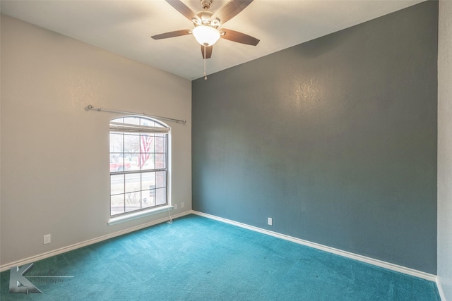 empty room with ceiling fan and carpet flooring