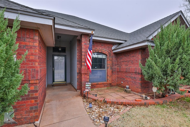 entrance to property featuring a patio