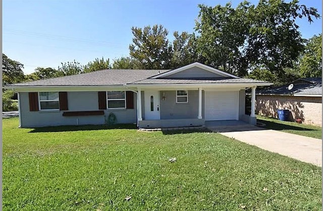 single story home with covered porch, a garage, and a front lawn