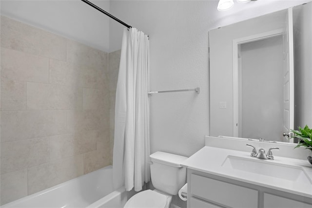 full bathroom with shower / tub combo with curtain, vanity, and toilet