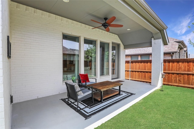 view of patio featuring ceiling fan