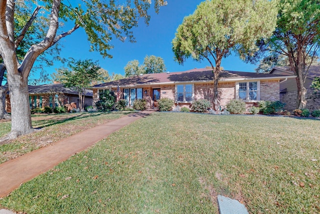 single story home featuring a front yard