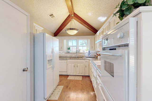 kitchen with white cabinetry, sink, lofted ceiling with beams, white appliances, and light wood-type flooring