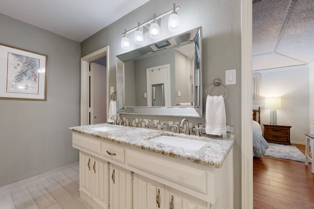 bathroom with vanity and hardwood / wood-style flooring