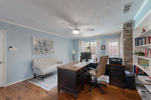 office space with a textured ceiling, ceiling fan, crown molding, and dark hardwood / wood-style floors