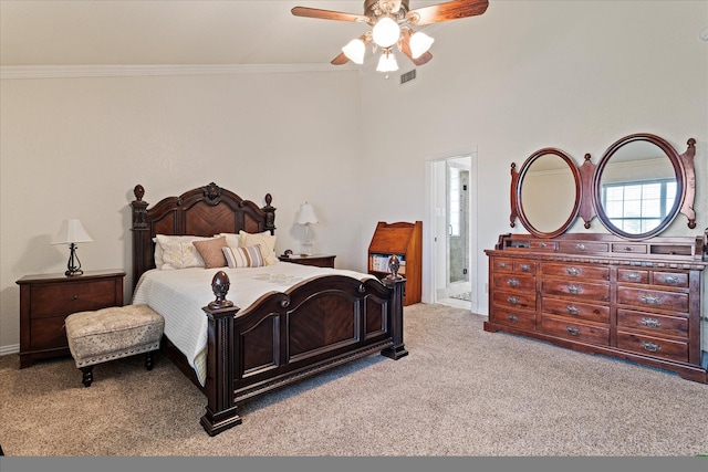 carpeted bedroom with connected bathroom, ceiling fan, and ornamental molding