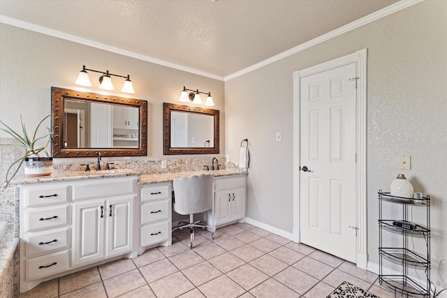 bathroom with crown molding, tile patterned floors, double vanity, a textured ceiling, and baseboards