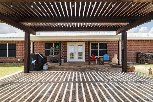 view of patio with area for grilling and french doors