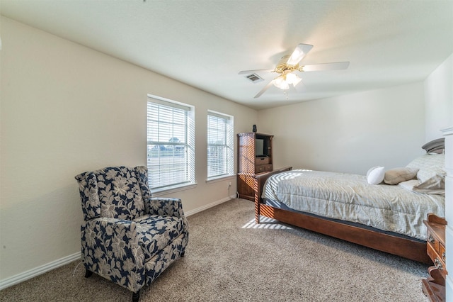 bedroom featuring carpet floors, a ceiling fan, and baseboards