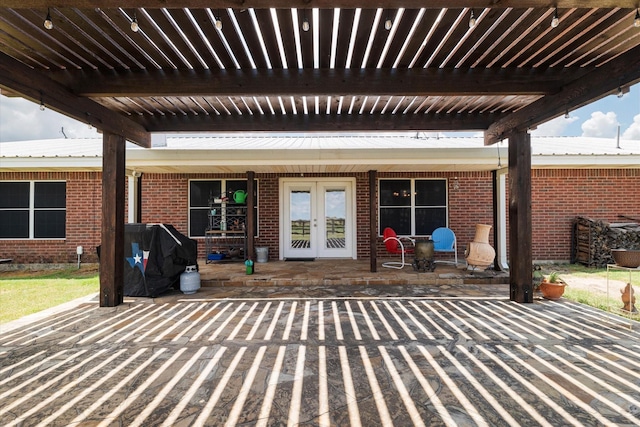 view of patio / terrace featuring french doors and a grill