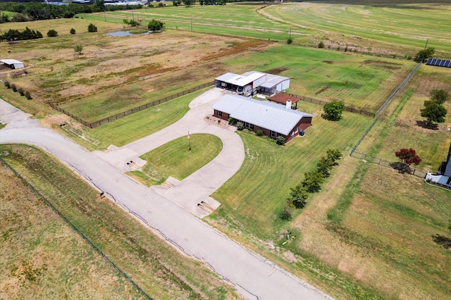 birds eye view of property with a rural view