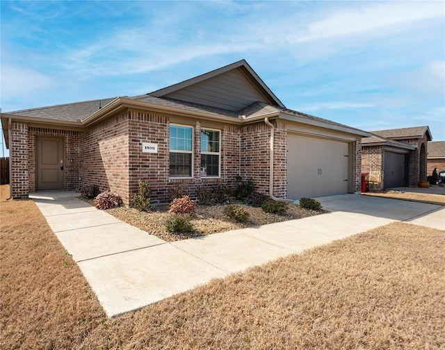 single story home with a garage and a front yard