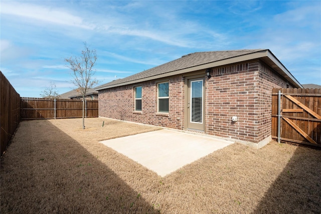 rear view of property featuring a patio area