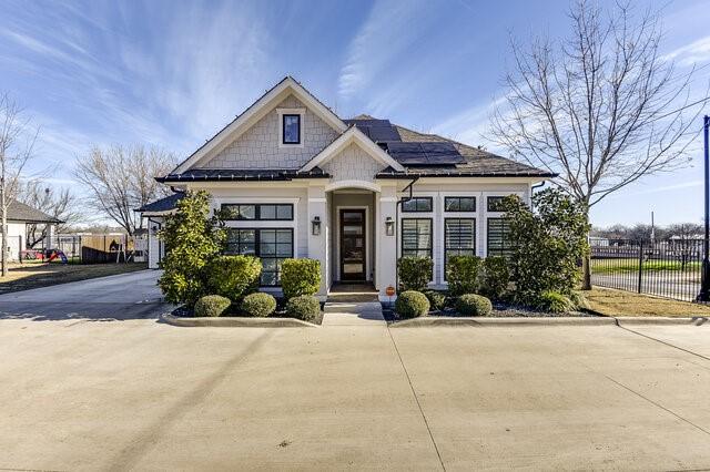 view of front of house featuring solar panels