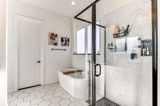 bathroom featuring plus walk in shower