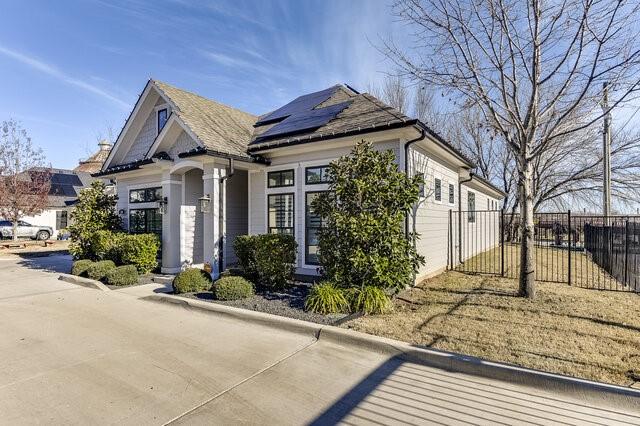 view of front of home featuring solar panels