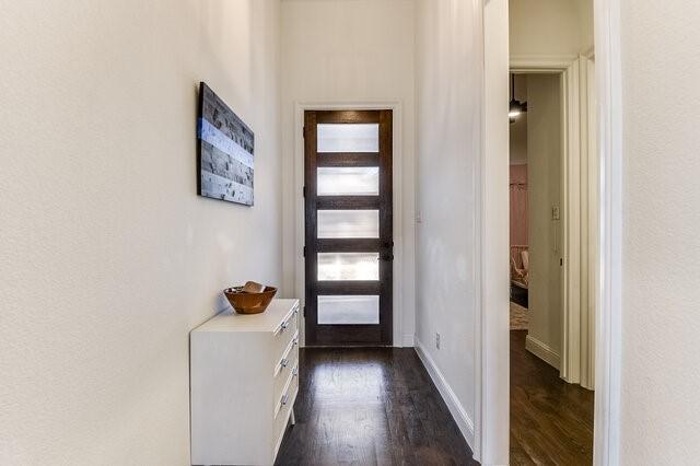 doorway to outside featuring dark wood-type flooring and french doors