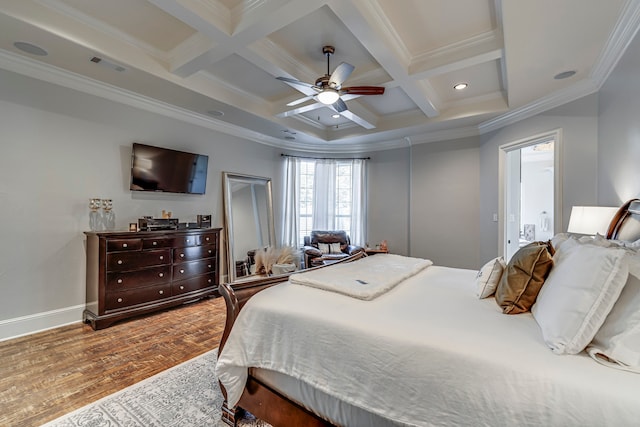 bedroom with wood-type flooring, coffered ceiling, crown molding, and beam ceiling