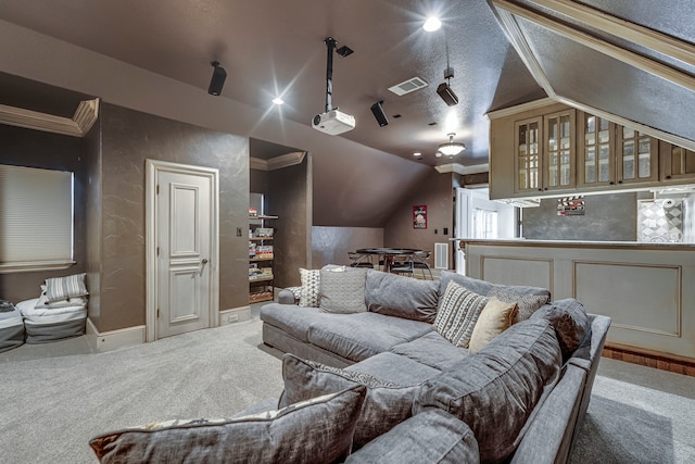 home theater with crown molding, vaulted ceiling, and carpet