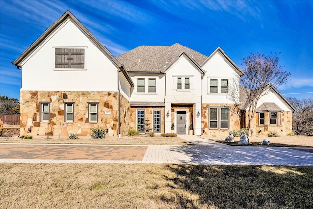 rear view of property featuring a yard