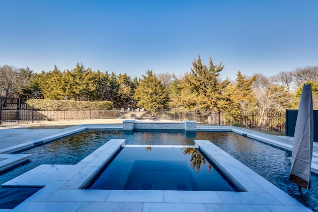 view of pool featuring an in ground hot tub