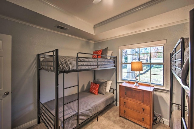 carpeted bedroom featuring ceiling fan and ornamental molding