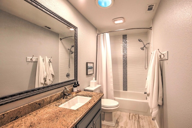 full bathroom featuring vanity, toilet, and shower / bathtub combination with curtain