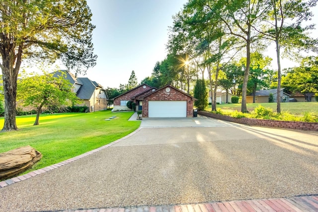 view of front facade with a front yard and a garage